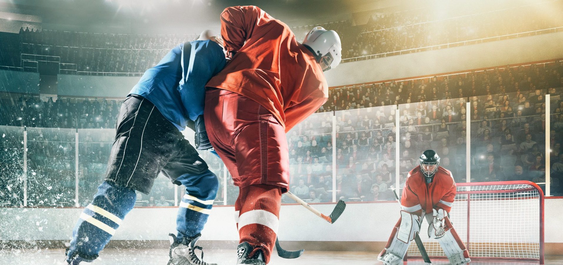 Two young adults playing Ice Hockey